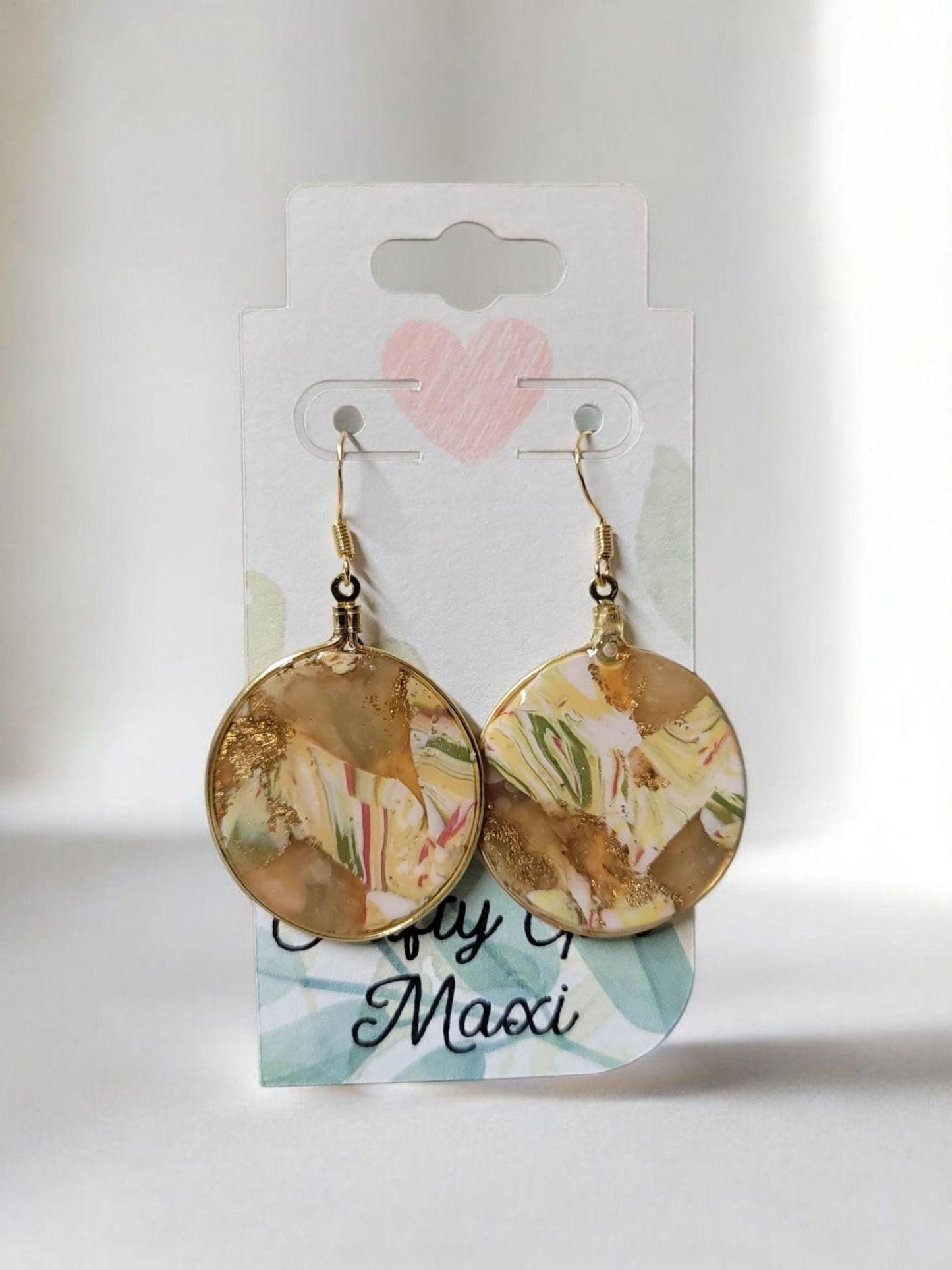 Fall hoop clay earrings made in autumn gold tones. Handmade round autumn clay earrings. Statement earrings. Lightweight modern earrings.