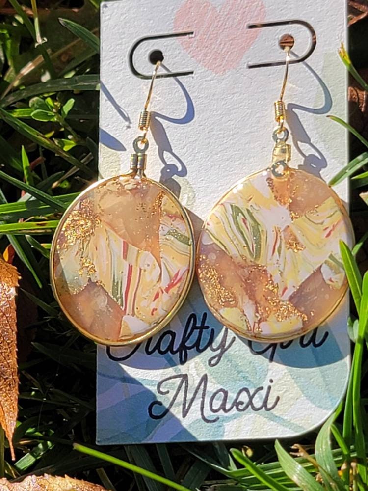 Fall hoop clay earrings made in autumn gold tones. Handmade round autumn clay earrings. Statement earrings. Lightweight modern earrings.